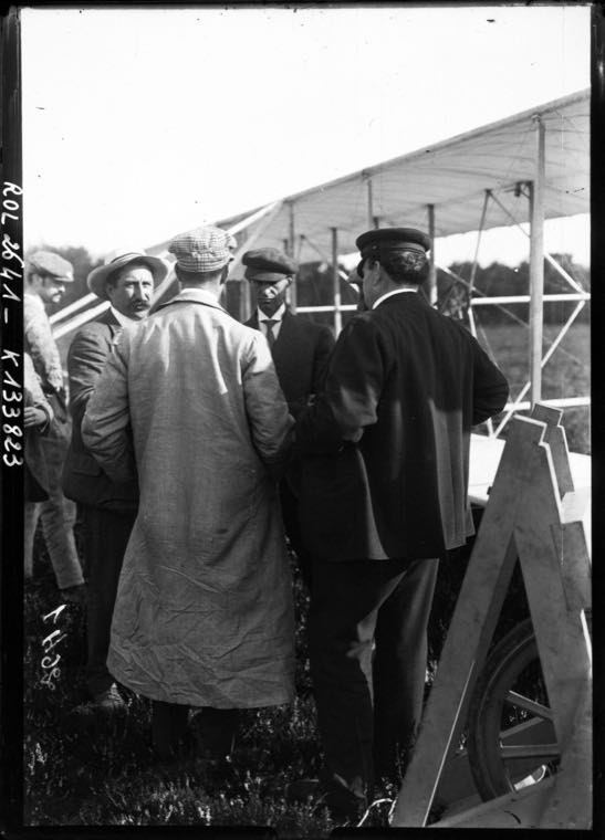 Wilbur Wright flying before a crowd at Camp d'Auvours, France, in 1908.